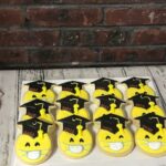 Graudation emoji smiley faces with a mask - 1 Dozen